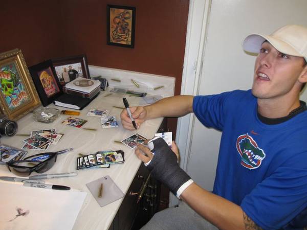 Jordan Schafer signs baseball cards